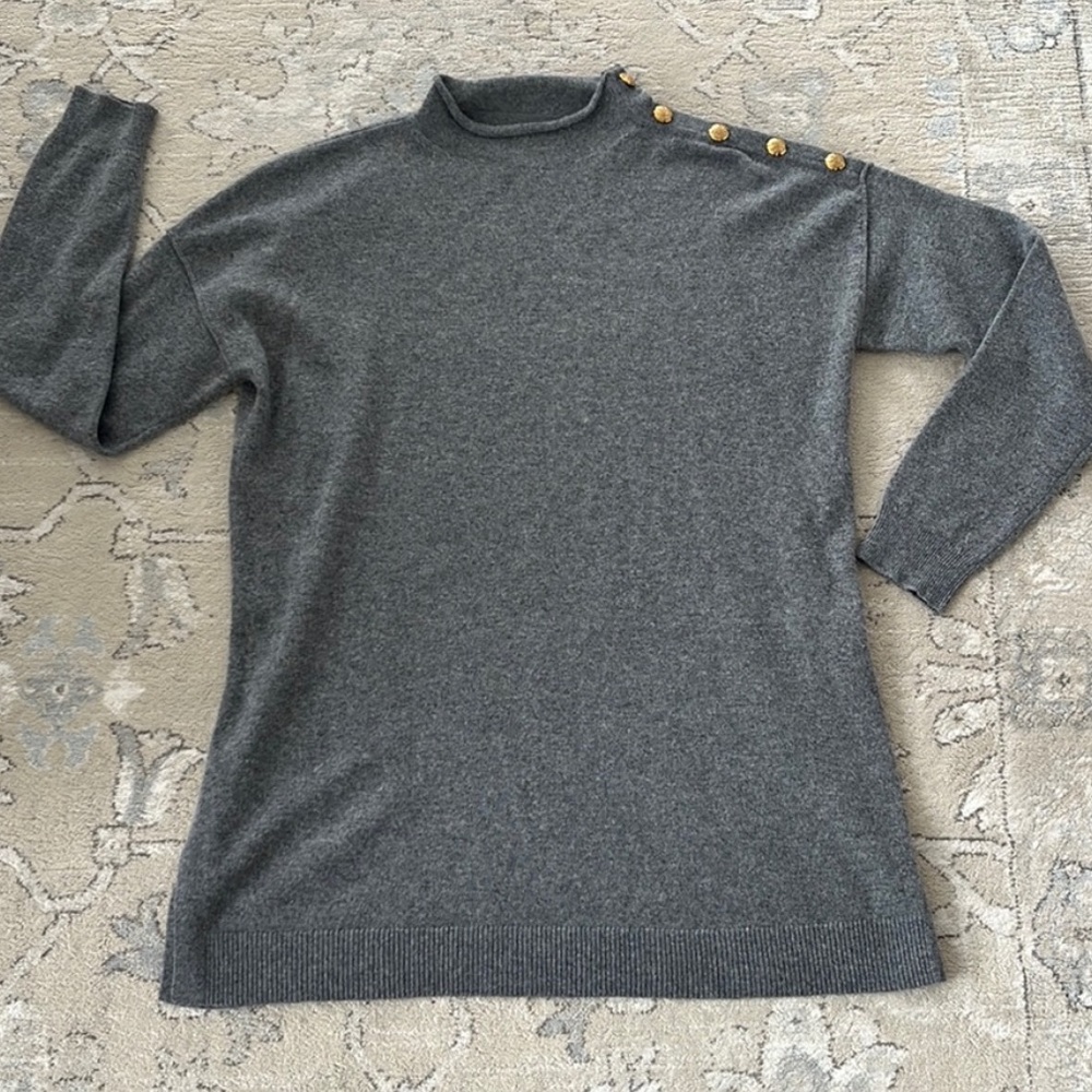 Ralph Lauren. 100% cashmere. Gray sweater. Gold colored buttons at the neckline.
